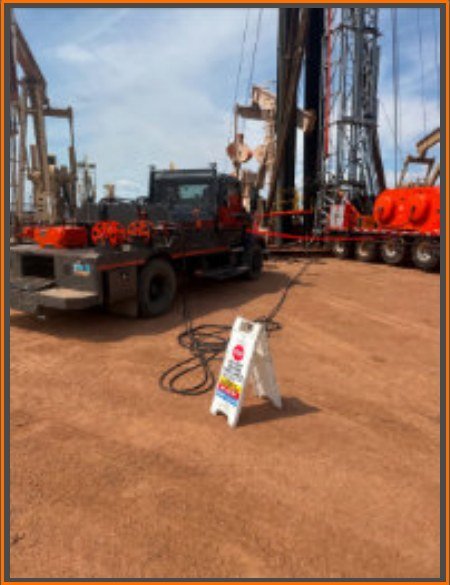 Dakota Chemical scan and hydrotest equipment on an oilfield location